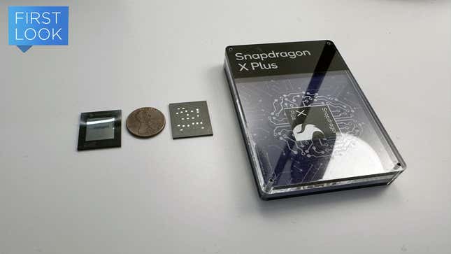 A Snapdragon X Plus chip in a plastic box surrounded by the chip's interior and exterior