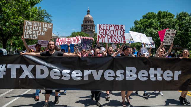 People protesting outside of the Texas State Capitol building.