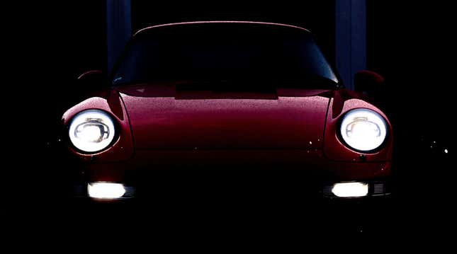 A photo of a wet red 993 with Ruf LED headlights 