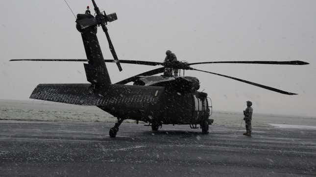 The pre-flight checks of a UH-60 Black Hawk before a logistical mission, on Chievres Air Base, Chievres, Belgium, Feb. 5, 2015. 