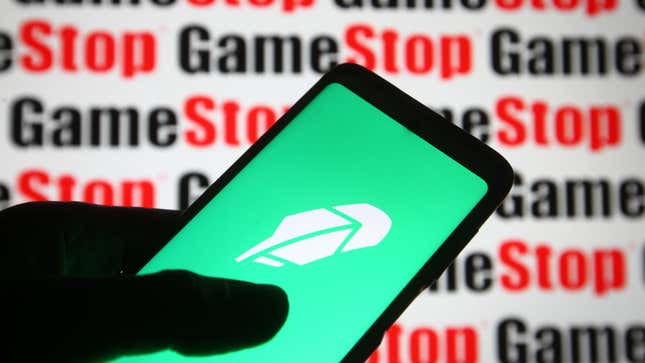 The Robinhood logo displayed in front of the logo of meme stock Gamestop, February 2021. 
