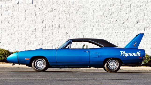 A side profile view of a Plymouth Superbird muscle car in blue. 