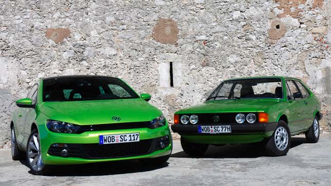 A photo of an original VW Scirocco parked alongside a new model. Both are green. 