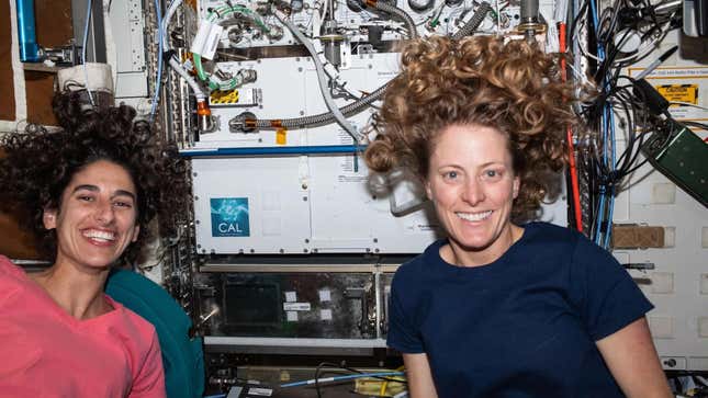 Expedition 70 Flight Engineers Jasmin Moghbeli and Loral O’Hara in front of the International Space Station’s Cold Atom Lab. 