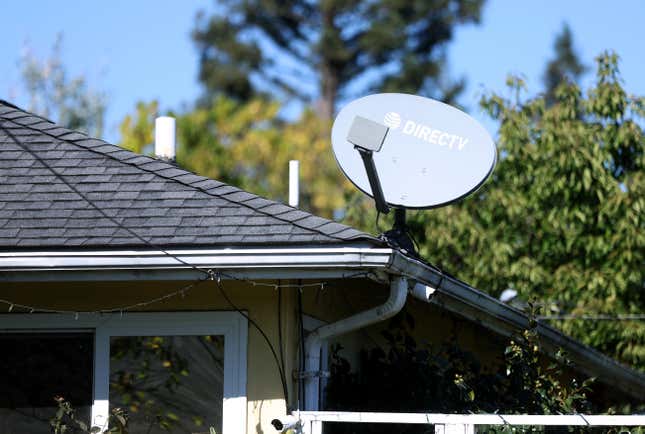 A DirecTV satellite dish is seen mounted to a building on October 01, 2024 in San Rafael, California..