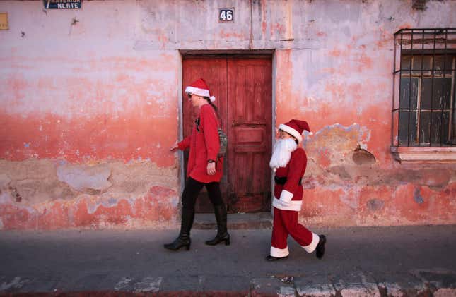 Claus walks beside his mother in Antigua, Guatemala
