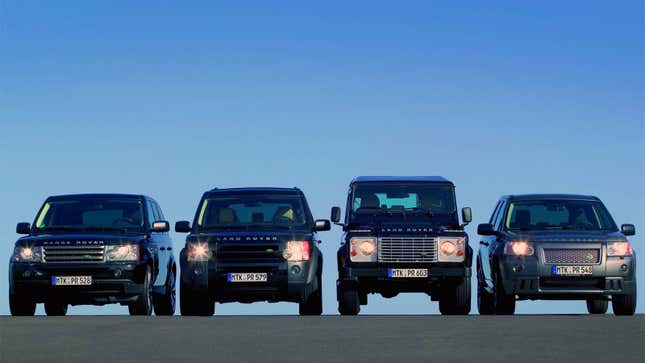 A photo of four Land Rover cars parked in a row. 