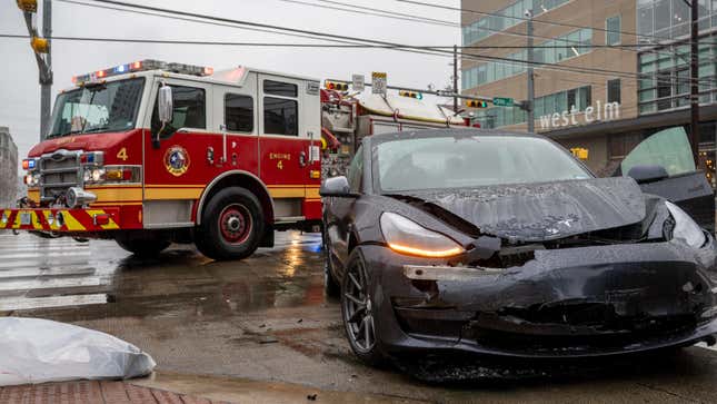 A gray Tesla Model 3 after a car crash.