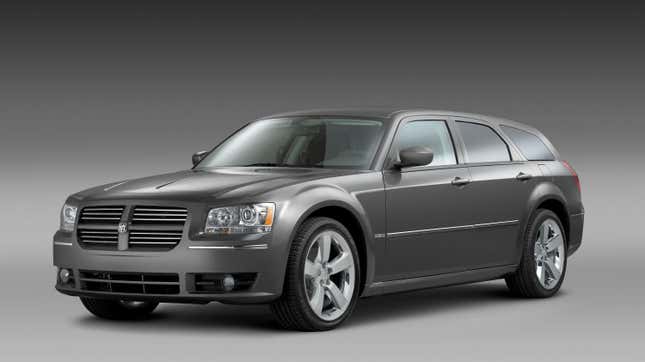 A gray Dodge Magnum in a studio,