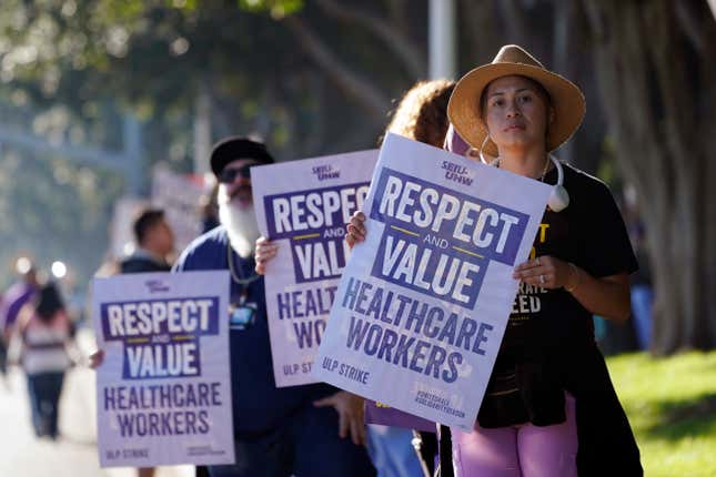 Kaiser Permanente workers picket Wednesday, Oct. 4, 2023, in Irvine, Calif. Some 75,000 Kaiser Permanente hospital employees who say understaffing is hurting patient care walked off the job Wednesday in five states and the District of Columbia, kicking off a major health care worker strike. (AP Photo/Ryan Sun)