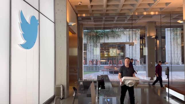 Elon Musk carrying a sink into Twitter HQ