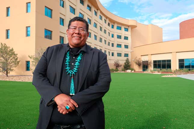 FILE - Dineh Benally poses for a photograph before a Navajo Nation presidential forum at a tribal casino outside Flagstaff, Ariz., Tuesday, June 21, 2022. Chinese workers allege they were lured to northern New Mexico under false pretenses and forced to work 14 hours a day trimming marijuana on the Navajo Nation where cultivating the plant is illegal, according to a lawsuit filed Wednesday, Sept. 27, 2023, in state court. The lawsuit names as defendants Navajo businessman Benally and Taiwanese entrepreneur Irving Lin, who was arrested in 2022 following a raid in California. (AP Photo/Felicia Fonseca, File)