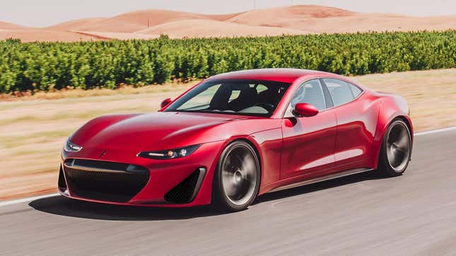 A red Drako GTE driving down a road.