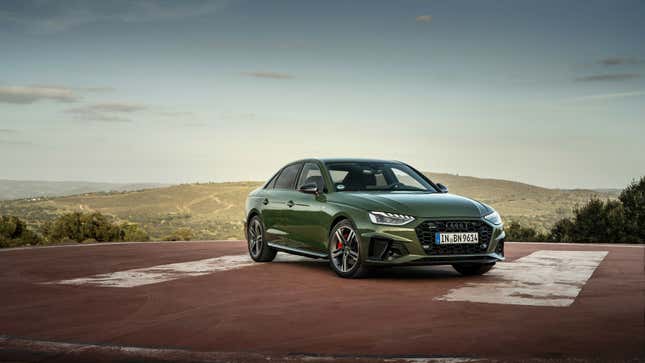 A photo of a dark green Audi A4 sedan. 