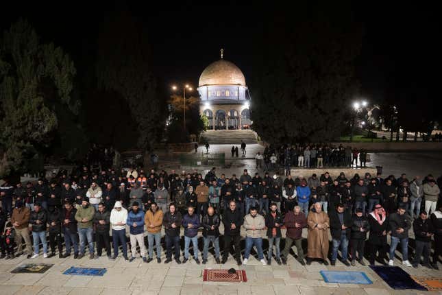 Muslim worshippers perform &quot;tarawih,&quot; an extra lengthy prayer held during the Muslim holy month of Ramadan, next to the Dome of Rock at the Al-Aqsa Mosque compound in the Old City of Jerusalem, Sunday, March 10, 2024. Officials in Saudi Arabia have declared the start of the fasting month of Ramadan after sighting the crescent moon Sunday night. The announcement marks the beginning of Ramadan for many of the world&#39;s 1.8 billion Muslims. (AP Photo/Mahmoud Illean)