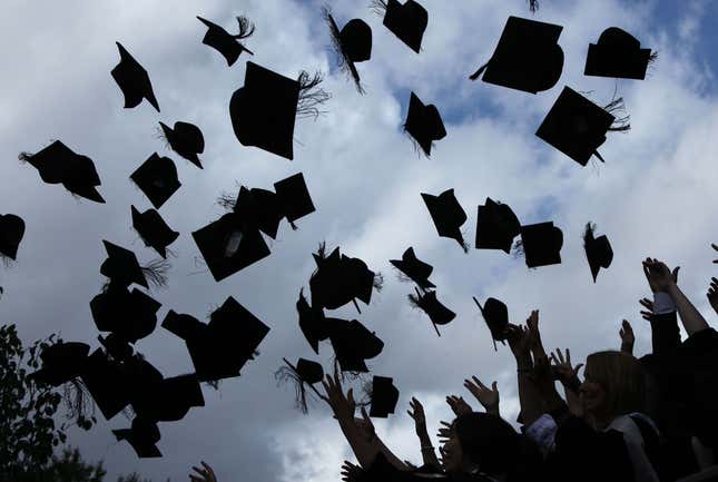 BIRMINGHAM, ENGLAND - JULY 14: Students throw their mortarboards in the air during their graduation photograph at the University of Birmingham degree congregations on July 14, 2009 in Birmingham, England. Over 5000 graduates will be donning their robes this week to collect their degrees from The University of Birmingham. A recent survey suggested that there are 48 graduates competing for every job. (Photo by Christopher Furlong/Getty Images)