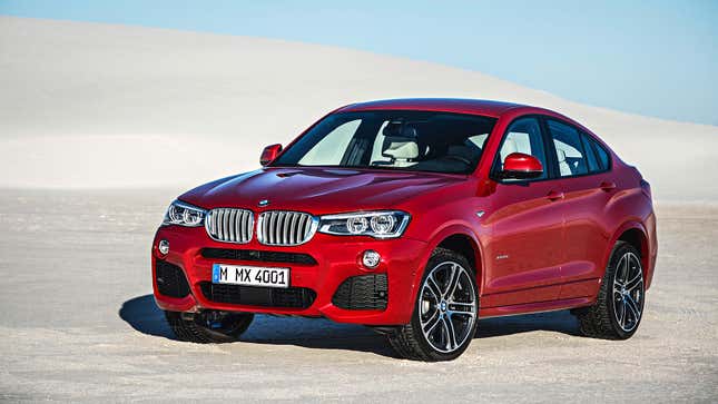 Red first-generation BMW X4 seen at a front-quarter angle.