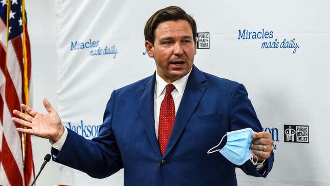 Florida Gov. Ron DeSantis speaks holding his facemask during a press conference to address the rise of coronavirus cases in the state, at Jackson Memorial Hospital in Miami, on July 13, 2020.