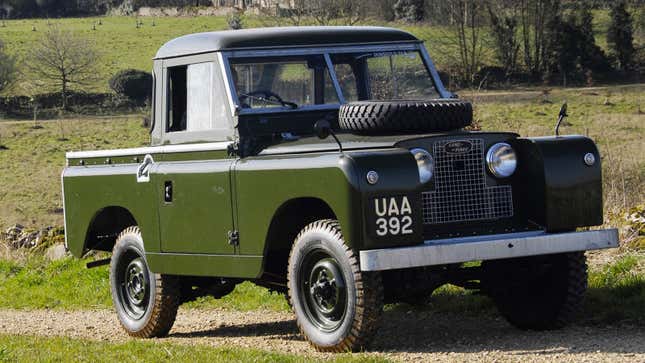 A photo of a green Land Rover pickup. 