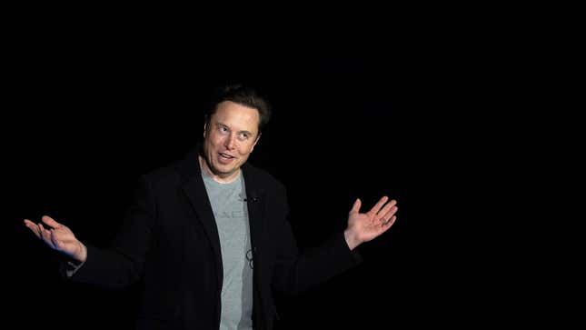 A photo of Elon Musk on stage. 