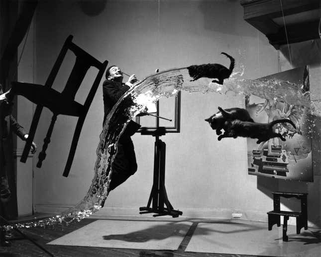 The unretouched version of Halsman’s “Dalí Atomicus,” showing fishing lines used to suspend the props, and without a painting in the center easel.