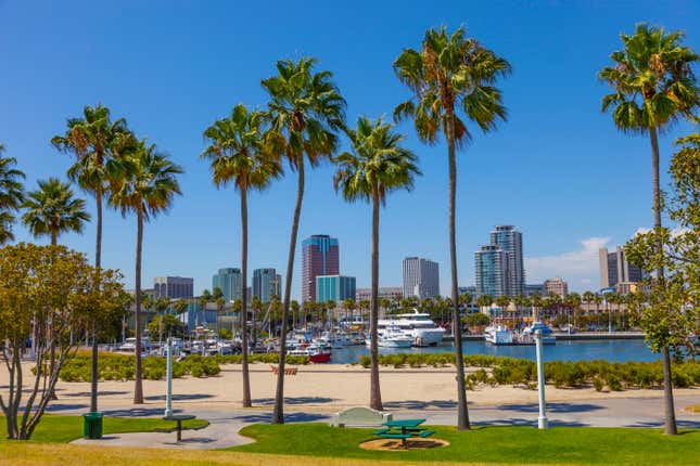 Rainbow Harbor with city skyline at Long Beach , CA. 