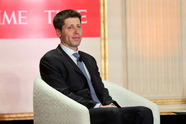 Sam Altman wearing a suit and tie sitting in a chair with a red TIME banner behind him