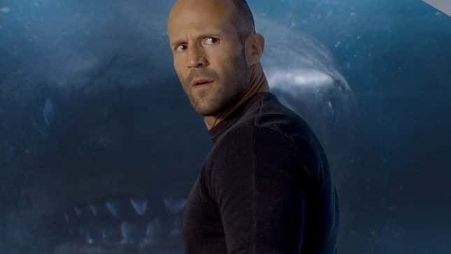 Man standing in front of a shark
