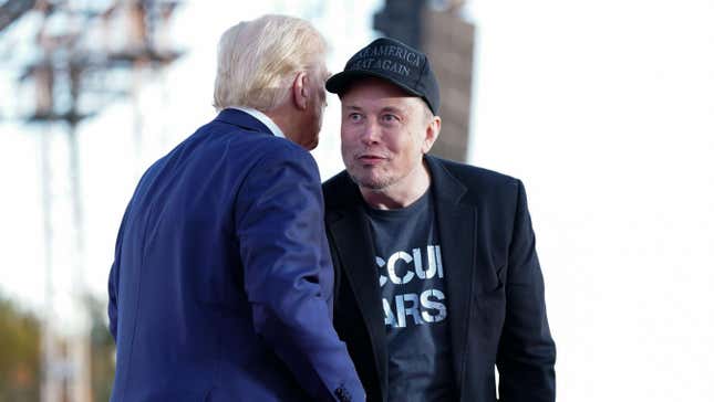 Tesla and SpaceX CEO Elon Musk speaks with former president Donald Trump during a campaign event at the Butler Farm Show, Saturday, Oct. 5, 2024, in Butler, Pa.