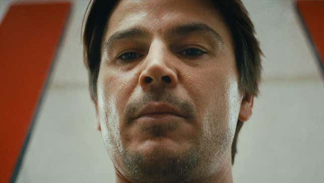 Josh Hartnett looks down at a twist. 