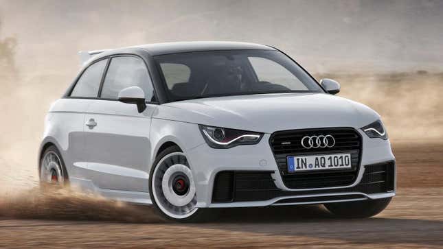 A white Audi A1 Quattro driving through the dirt 