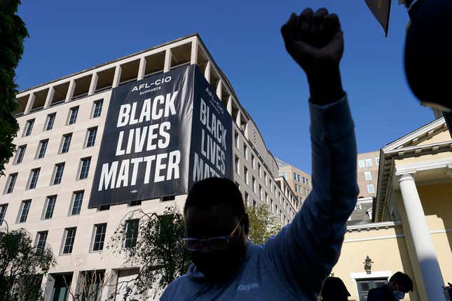 A person reacts on April 20, 2021, in Washington, at Black Lives Matter Plaza near the White House after the verdict in Minneapolis, in the murder trial against former Minneapolis police officer Derek Chauvin was announced. Few Americans believe there has been significant progress over the last 50 years in achieving equal treatment for Black people in dealings with police and the criminal justice system. That’s according to a new poll by The Associated Press-NORC Center for Public Affairs Research.