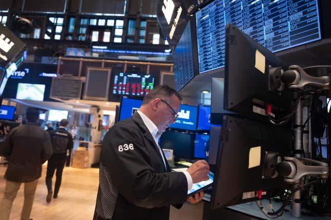 Traders work on the floor of the New York Stock Exchange