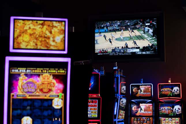 A basketball game on a TV screens seen among electronic betting machines at Turfway Park Racing &amp; Gaming, Friday, Dec. 22, 2023, in Florence, Ky. Sports betting has spread rapidly across U.S. states in the past five years. But the odds for further expansion may be fading as state legislatures prepare to return to work in 2024. (AP Photo/Carolyn Kaster)