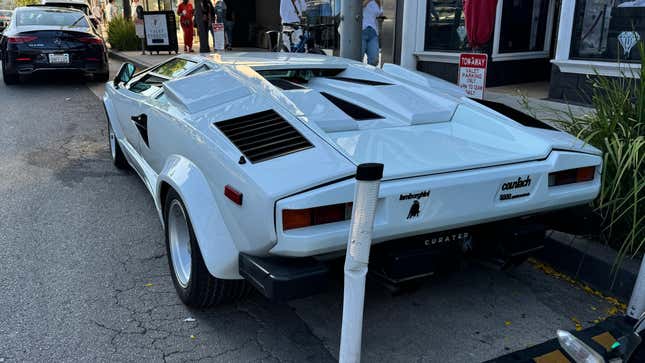 Rear 3/4 view of a white Lamborghini Countach