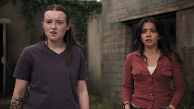 Ellie and Dina look at something off-screen in the distance.