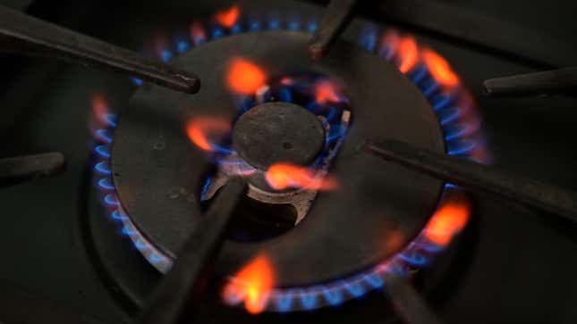 A photo illustration shows gas burning on a domestic hob in Liverpool, north-west England on September 20, 2021.