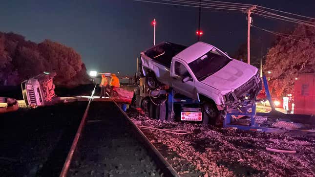 Image for article titled This Is What Happens When A Speeding Amtrak Train Strikes A Stranded Car Hauler