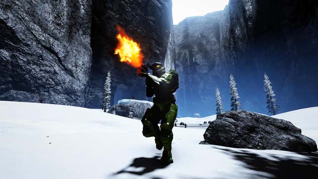 A Spartan races forward while firing a gun in a snowy canyon.