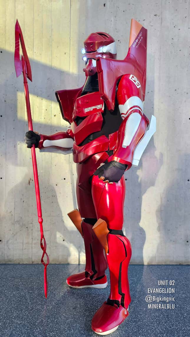 A Unit 02 cosplayer stands tall at Anime NYC 2023.
