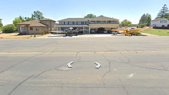 Google Earth Screenshot of a home with two planes in the front yard