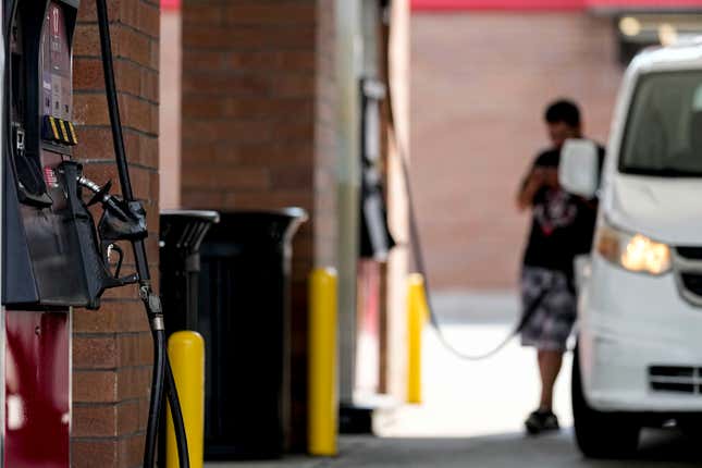 FILE - A person pumps gas, on Sept. 12, 2023, in Marietta, Ga. Oil prices have risen, meaning drivers are paying more for gasoline and truckers and farmers more for diesel. The increase also is complicating the global fight against inflation and feeding Russia&#39;s war chest to boot. (AP Photo/Mike Stewart, File)