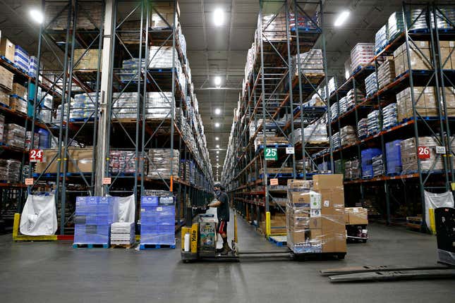 A warehouse worker fills orders at a distribution center in Riverside, California.