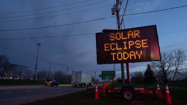 A photo of a sign saying "solar eclipse today". 