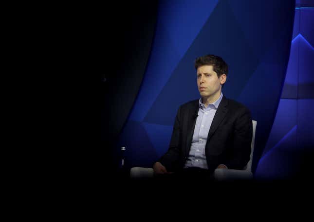 sam altman sitting in a chair looking into the distance 