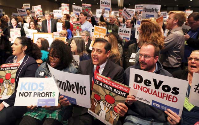 California educators protest DeVos at a teachers’ association meeting in January. (AP Photo/Reed Saxon)
