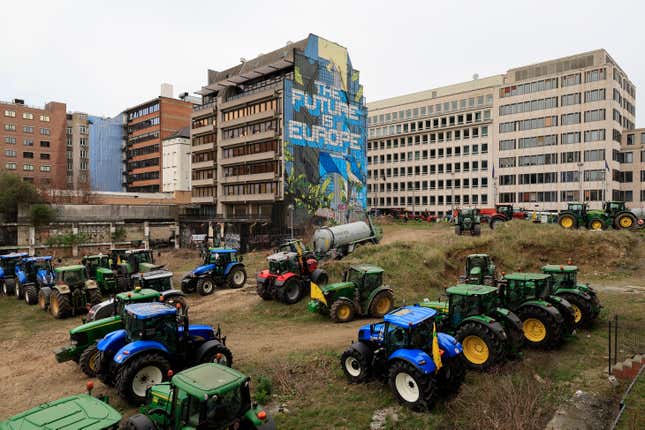 Farmers park their tractors near the European Council building in Brussels during a demonstration on Tuesday, March 26, 2024. Dozens of tractors sealed off streets close to European Union headquarters where the 27 EU farm ministers are meeting to discuss the crisis in the sector which has led to months of demonstrations across the bloc. (AP Photo/Geert Vanden Wijngaert)