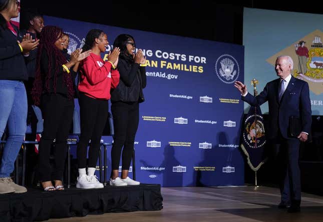 President Joe Biden waves to students as he arrives to speak about student loan debt relief at Delaware State University, Friday, Oct. 21, 2022, in Dover, Del. 