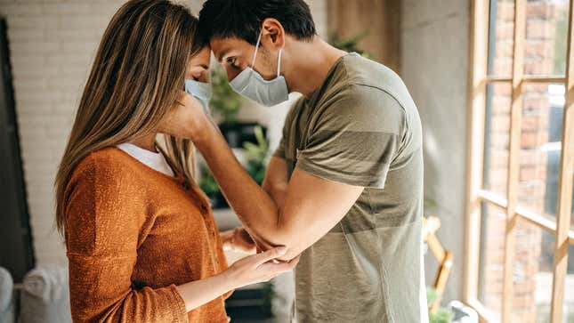 Image for article titled Couple Who Met During Pandemic Tenderly Remove Each Other’s Mask Straps For First Time