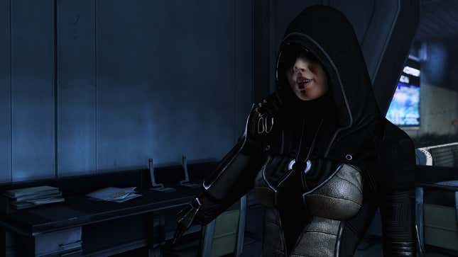 Kasumi is shown wearing a hood and talking to someone off-screen.